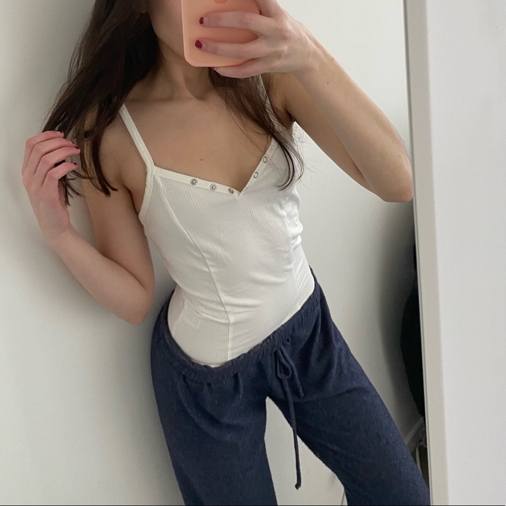 Brand new unworn white button down tank top. Bought from a boutique